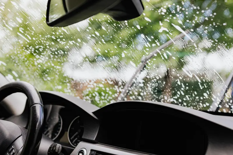 Cleaning the inside of a soapy windshield
