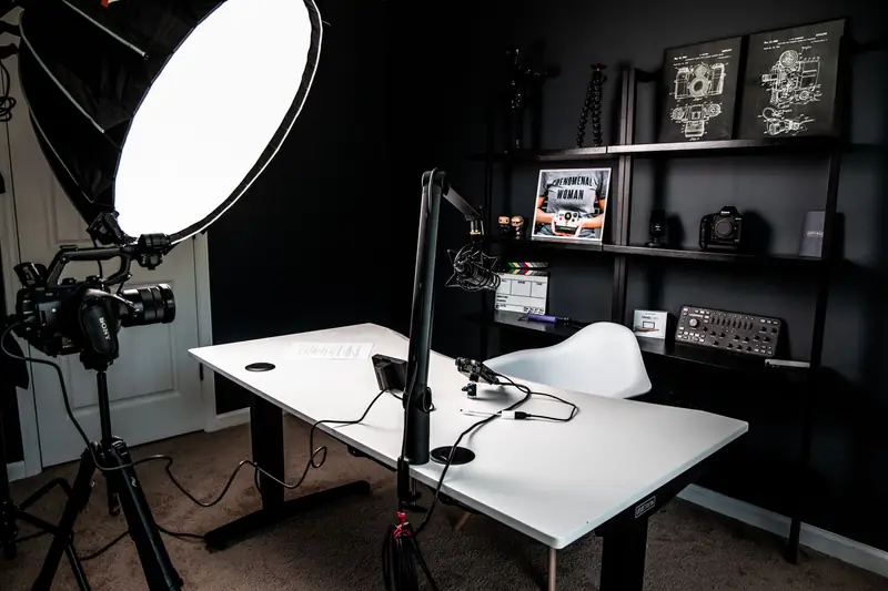 Studio lights aimed at a filming corner