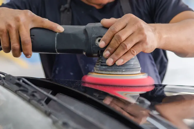 A dual action polisher against car paint